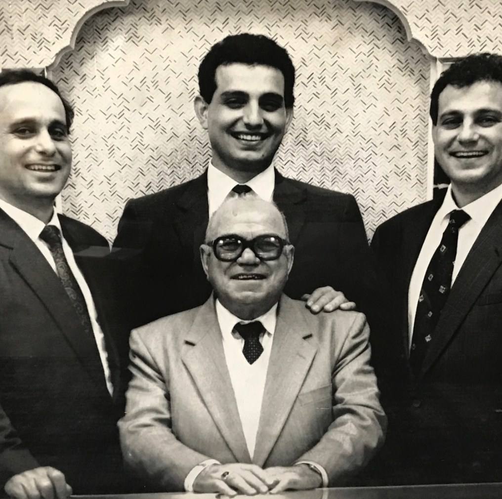 Black and white family portrait of the Homsy Jewelers, three generations at the Jewelers Building in Downtown Boston