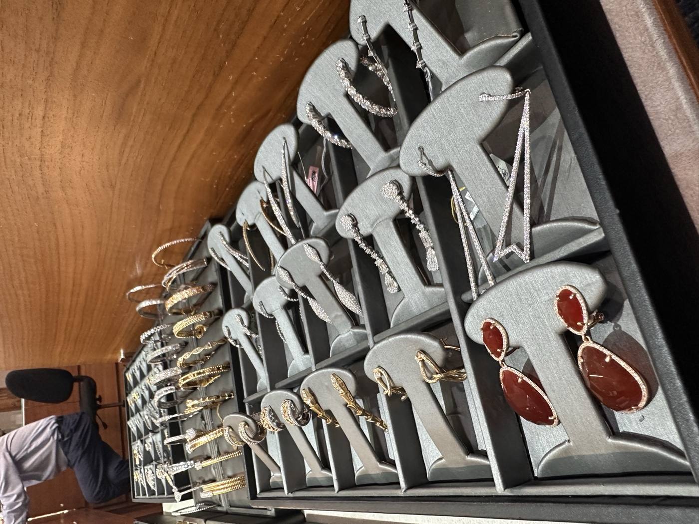 Drop earrings case with gold and gemstone styles at Homsy Jewelers Boston