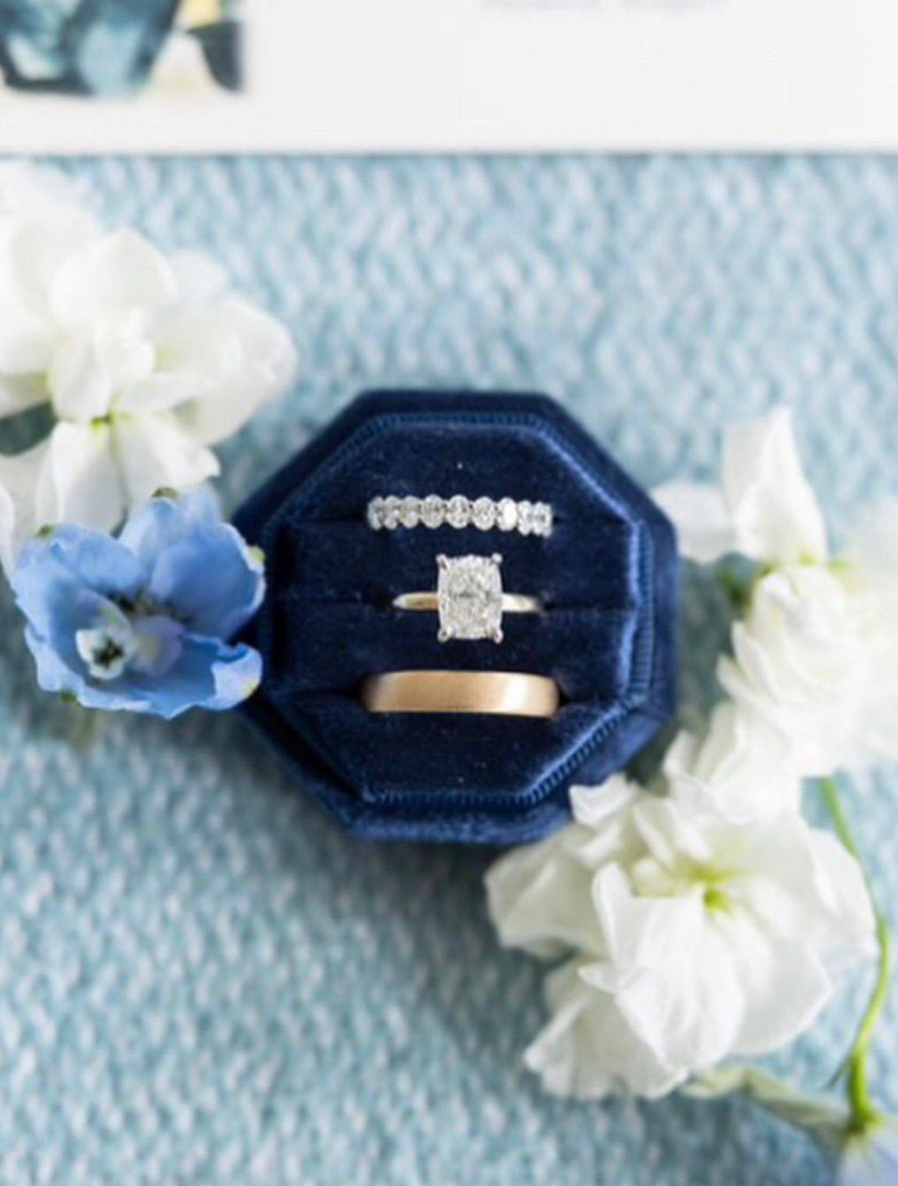 Diamond eternity band set with an engagement ring at Homsy Jewelers Boston