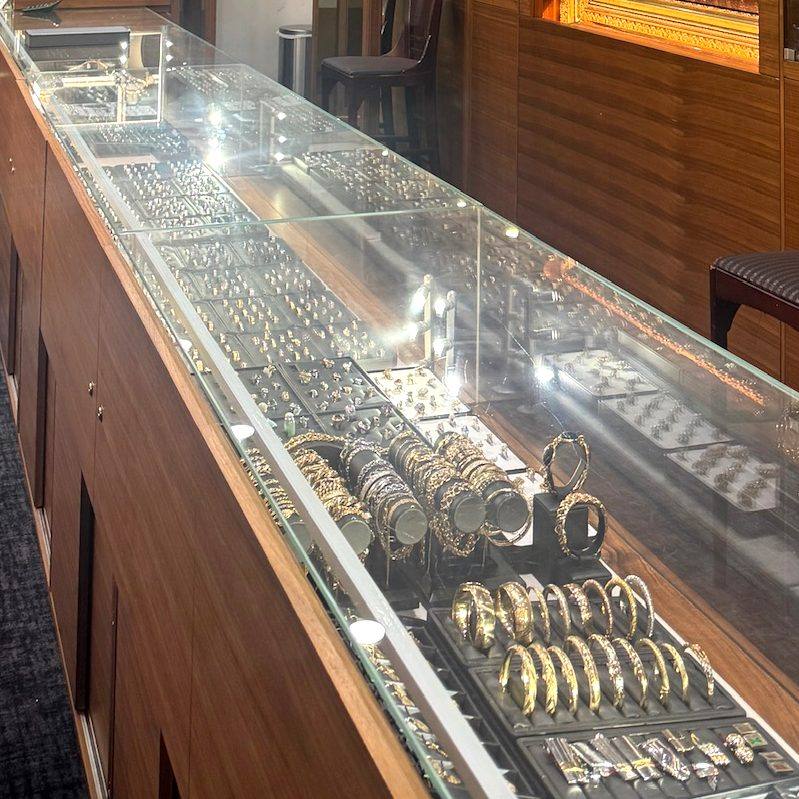 Gold bangles and bracelets in the display case at Homsy Jewelers in Downtown Boston