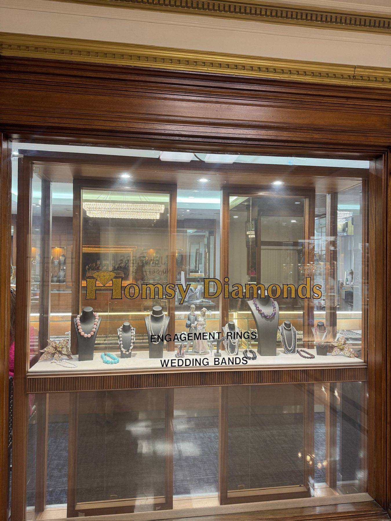 A curated window display of fine jewelry at Homsy Jewelers in the Jewelers Building, Boston